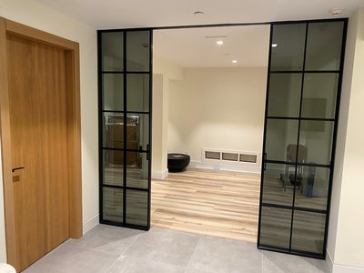 Modern Black Sliding Door with Tinted Glass West Hampton Beach, NY