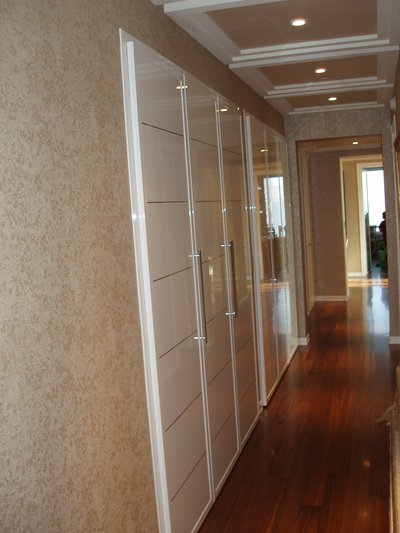 Custom closet doors in glossy white finish from MIRIA collection