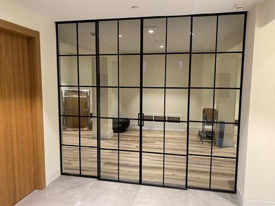 Modern Black Sliding Door with Tinted Glass West Hampton Beach, NY